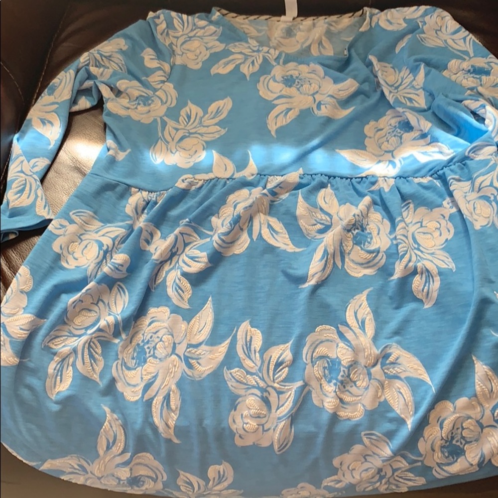 Baby doll style top, blue with white flowers.
